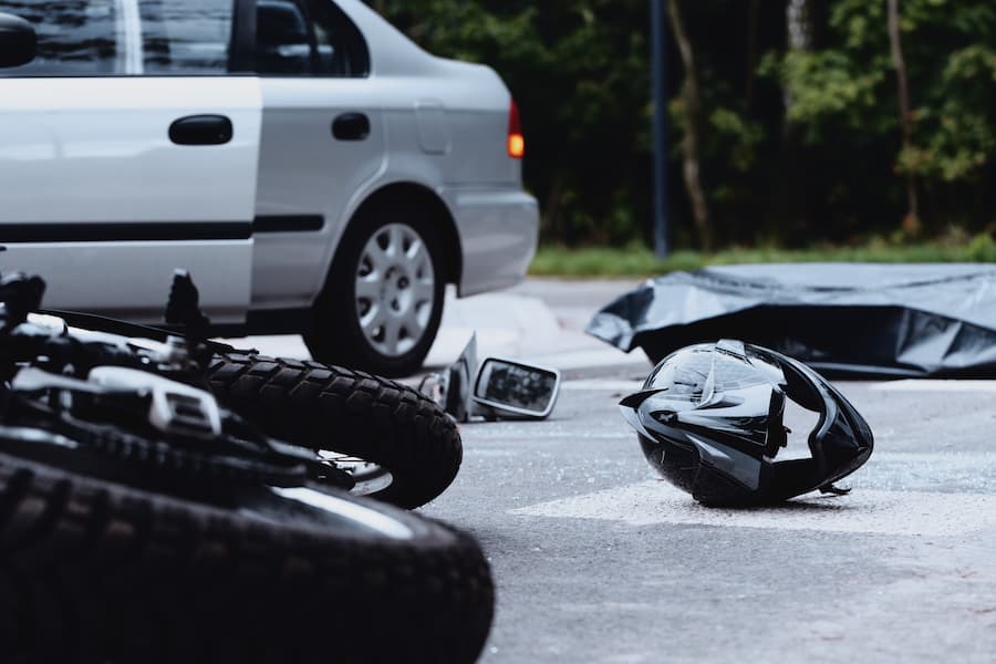 Motorcycle on the ground after accident with a vehicle in North Dakota
